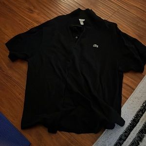Lacoste size 8 black polo. Worn in good condition